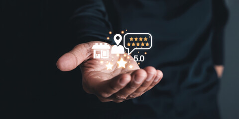 Fototapeta premium Hand holding digital icons of store, location, reviews and stars customer service