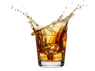 Whiskey splash in glass isolated on transparent background