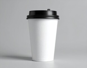 White coffee cup with black lid against a plain gray background