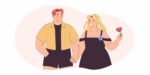 A young couple holding hands with one offering a heart shaped gift