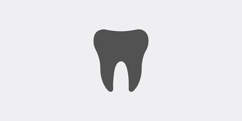 Simple illustration of a single dark gray tooth on a light background