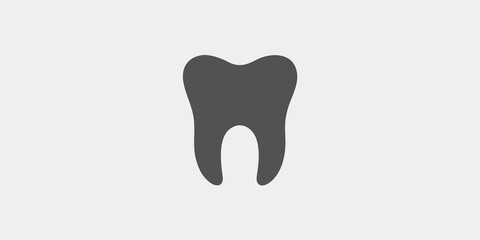 Simple illustration of a single dark gray tooth on a light background