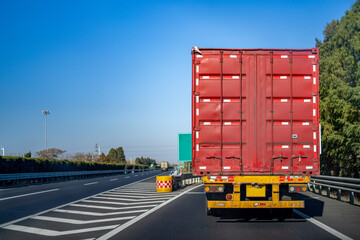 Naklejka premium Red Cargo Truck on Highway Road