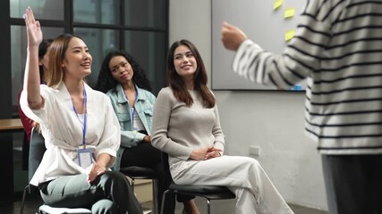 Diverse group of women participating in an interactive workshop or training session, symbolizing education, team engagement, learning, communication, and professional development in the workplace. - Powered by Adobe