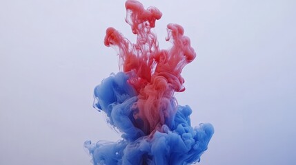 Red and blue ink mixing in water creating abstract color patterns and swirls