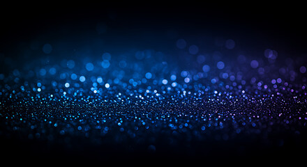 Blue glittering particles in dark background