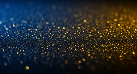 Golden glittering particles on dark blue background