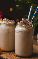 Glasses of butterbeer with a cap of whipped cream