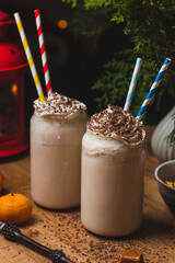 Glasses of butterbeer with a cap of whipped cream