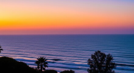 Ocean horizon at sunset with calm sea waves and coastal trees silhouette. Natural landscape with gradient sky and water surface. Seascape and coastal nature