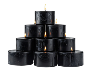 A pyramid of black candles with lit flames against a black background