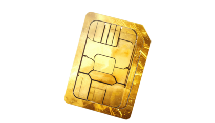 A macro shot of a gold-colored SIM card, isolated against black