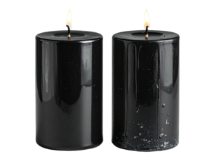 Two black cylindrical candles, lit with flickering flames, isolated on black