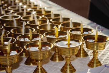 Buddhist Altar Candles at Religious 108 Butter Lamp Festival in Temple Monastery. Pouring Melted Butter Oil. Preparation process