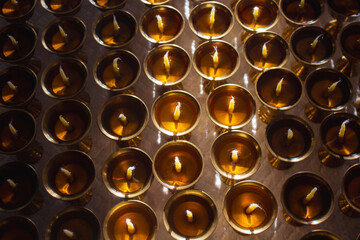 Buddhist Altar Candles at Religious 108 Butter Lamp Festival in Temple Monastery. Pouring Melted Butter Oil. Preparation process