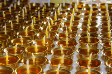 Buddhist Altar Candles at Religious 108 Butter Lamp Festival in Temple Monastery. Pouring Melted Butter Oil. Preparation process