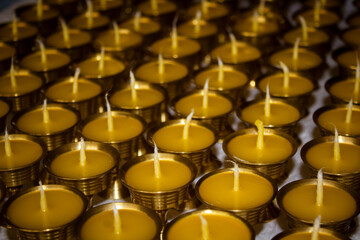 Buddhist Altar Candles at Religious 108 Butter Lamp Festival in Temple Monastery. Pouring Melted Butter Oil. Preparation process