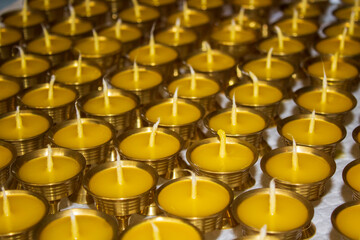 Buddhist Altar Candles at Religious 108 Butter Lamp Festival in Temple Monastery. Pouring Melted Butter Oil. Preparation process