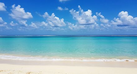 Obraz premium Serene beach with crystal clear turquoise water and blue sky