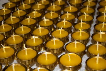 Buddhist Altar Candles at Religious 108 Butter Lamp Festival in Temple Monastery. Pouring Melted Butter Oil. Preparation process