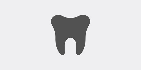 Simple illustration of a single dark gray tooth against a light background