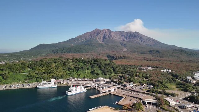 Sakurajima Volcano, Kagoshima, Kyushu Island, Japan: 4K Aerial Drone Footage of Active Volcano, Kagoshima Bay, Ferry Station, Boats, Port, Coastal Town, Scenic Mountains, Kinko Bay Landscape