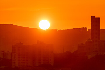 Urban development of Vladivostok at dawn. Bright dawn in Vladivostok.