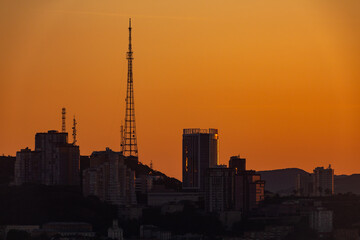 Urban development of Vladivostok at dawn. Bright dawn in Vladivostok.