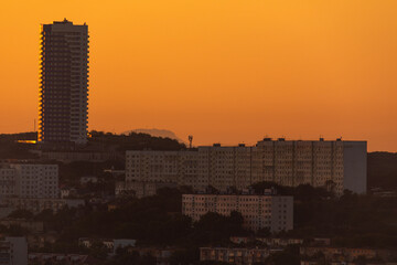 Urban development of Vladivostok at dawn. Bright dawn in Vladivostok.