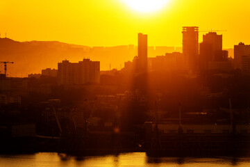 Urban development of Vladivostok at dawn. Bright dawn in Vladivostok.