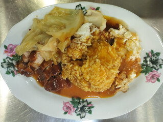 pork belly curry rice dish with fried egg