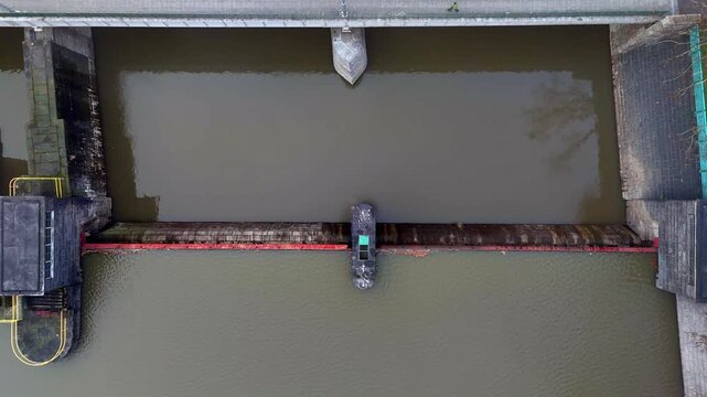 Aerial drone view of water lock on Oder River in Wroclaw, geometric composition of concrete and calm river
