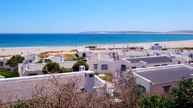 Whitewashed fishermen's cottages in scenic Paternoster on Cape West Coast overlooking idyllic turquoise Atlantic ocean