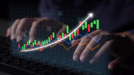 Close-up of hands typing on a keyboard with digital financial graphs displayed on screen, illustrating significant growth and market analysis in a modern workspace. Copula - Powered by Adobe