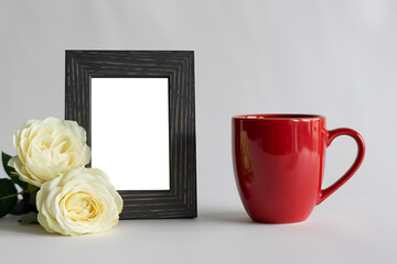 Fresh Red Coffee Mug with Elegant Black Thin Wooden Photo Frame and White Roses on Pure White Background