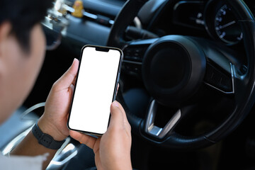Man holding smartphone empty screen device template, clipping path in car