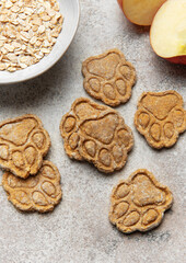 Homemade apple oatmeal dog treats shaped as paw prints