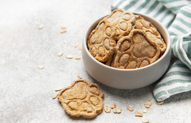 Homemade paw print dog treats with oats