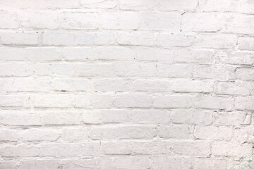 The texture of an old whitewashed brick wall. White brick wall