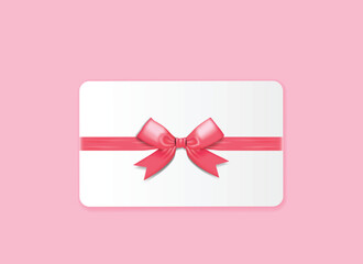 White Gift Card with Pink Ribbon and Bow on Pink Background