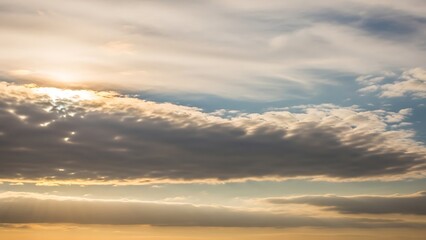 Fototapeta premium Dramatic clouds and sun rays in a vibrant sky