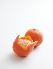 Peeled Mandarin Orange with Whole Tangerine Isolated on White Background
