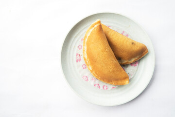 Homemade Pancake Duo on blue Dish