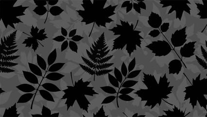 Fototapeta premium Monochromatic pattern of diverse autumn leaves and ferns in silhouette