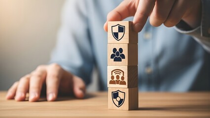 Conceptualizing security and protection services with human resources and customer support icons on stacked wooden blocks