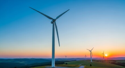 Wind turbine stand on hill at sunset with vibrant sky. Renewable energy concept for sustainable power generation and environmental conservation.