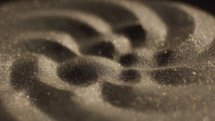 Close-up of Cymatics patterns in sand