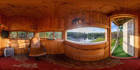 Full seamless 360 degree HDRI spherical panorama. Tower for hunters with video surveillance cameras for animals and windows for guns. Hunting tower in a swamp in a dense forest in sunny weather
