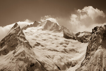 Glacier in winter mountains.