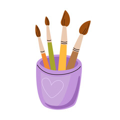 Purple glass with four paint brushes. Glass cup with heart, colorful watercolor accessories